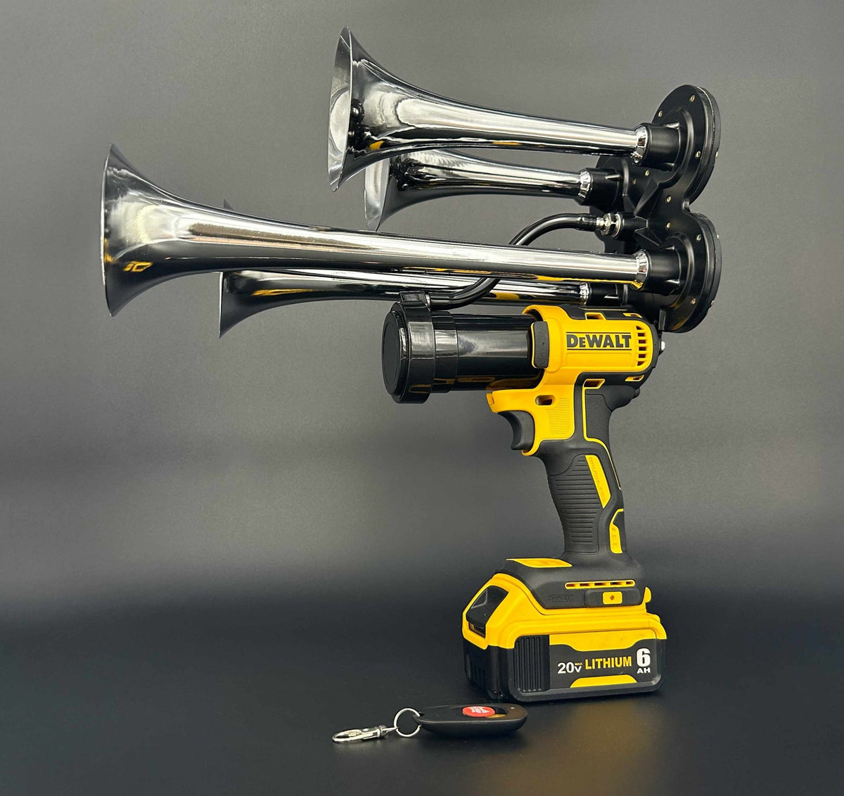 DeWalt Train Horn with chrome trumpets and remote control on black background