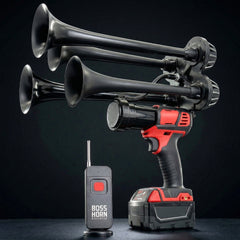 Black air horn system with red and black power drill and remote control on a dark background