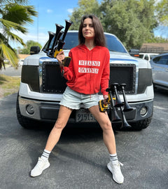 Girl holds DeWalt Train Horn in front of the Ford F150 truck