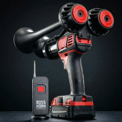 Black and red cordless horn drill with remote control on a dark background